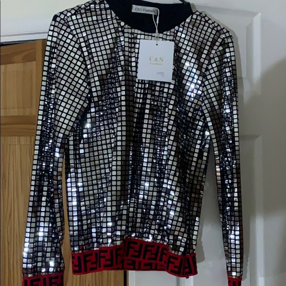 This beautiful blouse with FENDI sign on the wrist